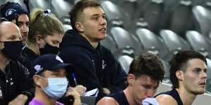 David Teague’s manager has criticised Blues captain Patrick Cripps,pictured on the sidelines during round 23,after Carlton delayed a call on the coach’s future. 