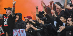 Tensions flare:The Red and Black Bloc react after an Oriol Riera goal for Wanderers against Sydney FC in the derby.