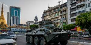 An armoured vehicle moves through Yangon on Sunday.