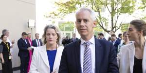Clare O’Neil and Andrew Giles leave a press conference after telling the gathered media they had to go to a division in the House.