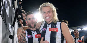 Darcy Moore and Jeremy Howe celebrate the win. 