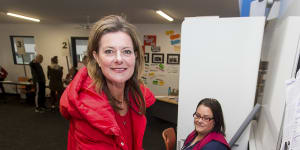 Kilkenny sporting her signature red puffer jacket while voting at Carrum Downs Secondary college during the 2018 state election.