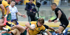 Michael Hooper is tackled during last week's Bledisloe epic in Wellington.