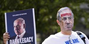 A protester demonstrates near The Watergate Hotel.