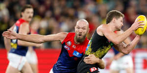 Jacob Hopper tackled by Max Gawn.