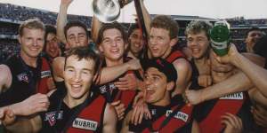 Gavin Wanganeen and Dustin Fletcher with teammates at the 1993 grand final. 