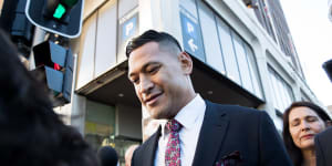 Israel Folau leaves a conciliation hearing at the Fair Work Commission.