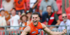 Jacob Hopper celebrates kicking a late goal for the Giants.