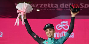 Jai Hindley celebrates on the podium after winning the ninth stage of the Giro d’Italia.