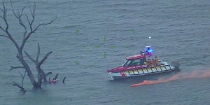 ‘They’re very lucky’:Eight people rescued from lake but their boat remains under water