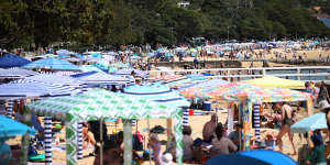 People soak up the sun at Balmoral Beach in Sydney’s north,