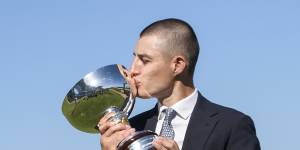 Trainer Dom Sutton poses with the trophy after Feroce’s big win.