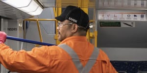 Sydney trains cleaner on a Tangara Train at Mortdale Depot.