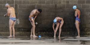 Port Melbourne Icebergers shower after swimming in the bay,which has had poor water quality.