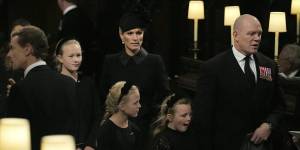 Savannah Phillips and Zara Tindall (back) and Isla Phillips,Lena Tindall and Mike Tindall at the committal service for the Queen.