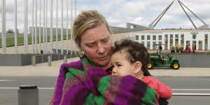 A single mother outside Parliament House in 2012 protesting against Labor’s cuts to the single parenting payment.