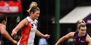 Docker Hayley Miller hunts a loose ball against St Kilda.