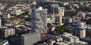 Barak’s image towers over Swanston Street on the facade of a Melbourne apartment building.