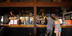 Locals line up for last drinks at the Commercial Hotel in Rappville.