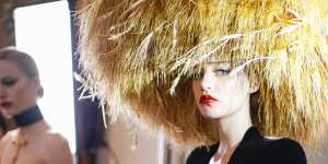 A model wears Schiaparelli couture for the autumn 2022 fashion show in Paris.