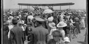 Crowd around the aeroplane:This image shows the Smith brothers arriving at Mascot airport after their record breaking flight in 1920.