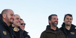 Donald Trump Jr (second right) on his arrival in Nuuk on Tuesday.