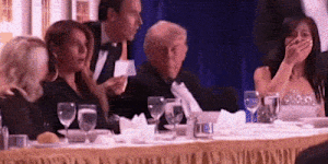 Trump taking cover at the dinner.