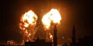 Flames are seen after an Israeli air strike hit Hamas targets in Gaza City,breaking a ceasefire agreed last month.