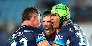 Cooper Bai celebrates a Titans try.
