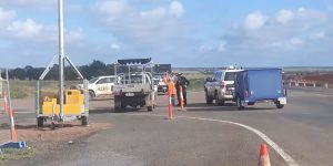 Woman in police custody after eight-hour Adani protest