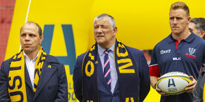 Rugby Australia’s Phil Waugh in 2022 alongside Rugby Victoria president Neil Hay and Reece Hodge,of the Melbourne Rebels.