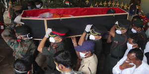 Indian army officers carry the coffin of Colonel B. Santosh Babu,killed during fighting on the China-India border in June,for his funeral in Suryapet,about 140 kilometres from Hyderabad. 