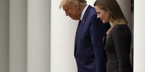 President Donald Trump walks with Judge Amy Coney Barrett to a news conference to announce Barrett as his nominee to the Supreme Court.