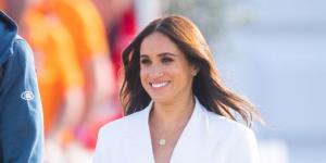 On day one,Meghan wore a white pant suit from Valentino. 
