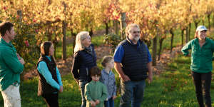 Winemaker Nick Farr,far left,with family and friends in the vineyard.
