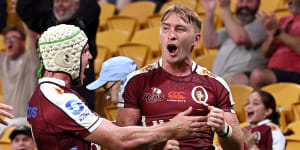 Tate McDermott celebrates a Reds try