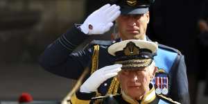 King Charles III and Prince William,the Prince of Wales,salute the Queen.