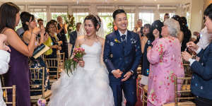 Kim Lee (right) and his wife,July Lies,on their wedding day in 2019. The couple met in 1999.