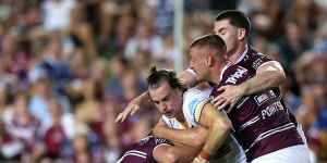 Eels fullback Clint Gutherson is wrapped up by the Sea Eagles defence.