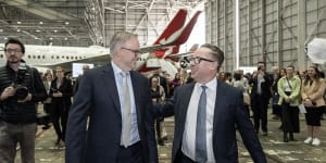 Prime Minister Anthony Albanese with then-Qantas chief Alan Joyce. Corporate giants such as Qantas,Wesfarmers,Rio Tinto and BHP have poured millions into the Yes campaign.