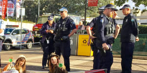 Climate change activists in canoe block Brisbane's Victoria Bridge