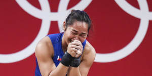 Hidilyn Diaz of the Philippines cries after winning the women’s 55kg weightlifting in Tokyo.