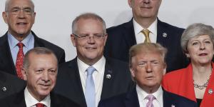 Turkish President Recep Tayyip Erdogan,Prime Minister Scott Morrison,US President Donald Trump and then UK PM Theresa May during the'family photo'at the G20 Summit in Osaka. Trump is said to be deferential to Erdogan and Vladimir Putin,but brutal with May.