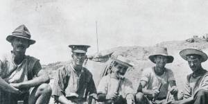 Men of the 8th Battalion in an abandoned Turkish position on Bolton's Ridge. 