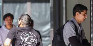 Sacked transport official Ibrahim Helmy runs from the Downing Centre on Thursday after his sentencing.