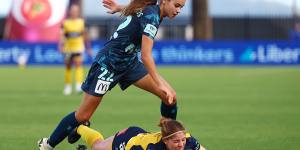 Sydney FC’s star teen Indiana Dos Santos keeps her feet against the Mariners’ Annabel Martin.