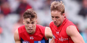 Darcy Parish,right,set the tone for the Bombers in the middle. 