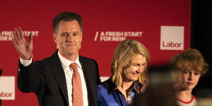 Labor leader Chris Minns with his wife Anna on stage at the Novotel Brighton.