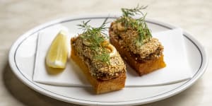 Sesame-encrusted crab toast is a play on Cantonese prawn toast.