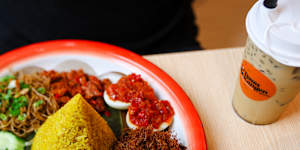 Nasi kuning (cone-shaped towers of rice tinted yellow with turmeric).
